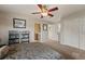 Spacious bedroom with ceiling fan, carpeted floors, neutral paint and two double-door closets for ample storage at 14037 Fairway Willow Ln, Winter Garden, FL 34787