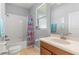 Bathroom featuring a tiled floor, toilet, tub with a shower, a sink, and a colorful shower curtain at 14137 Queenside St, Orlando, FL 32824