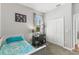 Bedroom with a desk, a carpeted floor, a window, and a closet featuring lots of natural light at 14137 Queenside St, Orlando, FL 32824