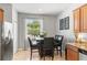 Dining area with tile flooring and view to backyard at 14137 Queenside St, Orlando, FL 32824