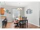 Bright dining room features a modern chandelier and a wooden table with seating for six at 14137 Queenside St, Orlando, FL 32824