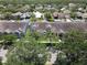 Aerial view of residential neighborhood with mature trees offering a serene living environment at 14262 Tanja King Blvd, Orlando, FL 32828