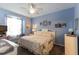 Bedroom featuring blue walls and plush carpet at 14262 Tanja King Blvd, Orlando, FL 32828