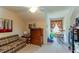 Cozy bedroom with vintage furniture and bright curtains creating a warm and inviting atmosphere at 14262 Tanja King Blvd, Orlando, FL 32828