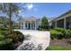 Inviting exterior of home featuring a covered porch with columns, manicured landscaping, and a serene atmosphere at 14262 Tanja King Blvd, Orlando, FL 32828