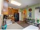 Eat in kitchen features wooden cabinetry, a black refrigerator and a breakfast nook at 14262 Tanja King Blvd, Orlando, FL 32828