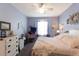 Serene bedroom with a comfortable bed, ceiling fan, and light, airy ambiance at 14262 Tanja King Blvd, Orlando, FL 32828