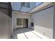 Enclosed patio space with sliding glass doors, perfect for outdoor seating and relaxation at 14262 Tanja King Blvd, Orlando, FL 32828