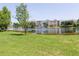 Community pond with a fountain offers residents beautiful water views and a tranquil natural setting at 14262 Tanja King Blvd, Orlando, FL 32828
