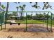 Community swingset surrounded by lush greenery, offering a relaxing recreational space at 14262 Tanja King Blvd, Orlando, FL 32828