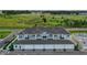 Aerial view showcasing a modern multi-Gathering residential complex with well-maintained landscaping and ample parking at 15201 Summer Harvest St, Winter Garden, FL 34787