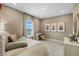 Cozy bedroom with a comfortable bed, natural light from the window, and a functional desk space at 15201 Summer Harvest St, Winter Garden, FL 34787