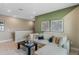 Bonus room with a comfortable sectional sofa, modern decor, and neutral paint at 15201 Summer Harvest St, Winter Garden, FL 34787