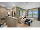 Bonus room with a comfortable sectional sofa, modern decor, and stair access at 15201 Summer Harvest St, Winter Garden, FL 34787