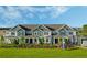 Attractive townhome features modern architecture and a well-manicured lawn, perfect for comfortable living at 15201 Summer Harvest St, Winter Garden, FL 34787