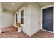 Charming front porch with seating area and brick flooring creates a welcoming entrance at 15201 Summer Harvest St, Winter Garden, FL 34787