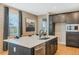Well-appointed kitchen featuring an island, stainless steel appliances, and plenty of cabinet space at 15201 Summer Harvest St, Winter Garden, FL 34787