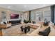 Comfortable living room with stylish furnishings, ample natural light, and a serene ambiance for relaxation at 15201 Summer Harvest St, Winter Garden, FL 34787