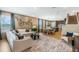 Spacious open-concept living area seamlessly connects the kitchen, dining, and seating spaces at 15201 Summer Harvest St, Winter Garden, FL 34787