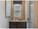 Mud room with drawers and a counter, artwork, and access to the outside through a glass-panel door at 15201 Summer Harvest St, Winter Garden, FL 34787