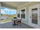 Relaxing patio with seating and a scenic lake view at 15201 Summer Harvest St, Winter Garden, FL 34787