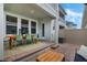 Covered patio showcasing an outdoor dining area, seating, and an open view of the backyard at 15201 Summer Harvest St, Winter Garden, FL 34787