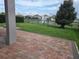 Spacious brick patio overlooking a fenced backyard with a beautiful water feature at 16124 Azure Key St, Winter Garden, FL 34787