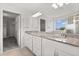 Elegant bathroom featuring granite countertops, double sinks, and walk-in shower at 16124 Azure Key St, Winter Garden, FL 34787