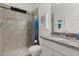 Bathroom featuring a tiled shower and a modern sink at 16124 Azure Key St, Winter Garden, FL 34787