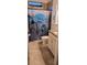 Bathroom featuring a unique blue floral shower curtain and marble countertops at 16124 Azure Key St, Winter Garden, FL 34787