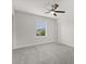 Bedroom featuring a ceiling fan and neutral carpet with a window view at 16124 Azure Key St, Winter Garden, FL 34787