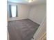 Neutral bedroom with a window, closet, and plush carpeting, perfect for a peaceful retreat at 16124 Azure Key St, Winter Garden, FL 34787