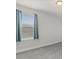 Bright bedroom with a window view and neutral carpet at 16124 Azure Key St, Winter Garden, FL 34787