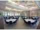 Large community event space featuring tables, chairs and elegant light fixtures at 16124 Azure Key St, Winter Garden, FL 34787