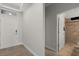 Entryway leads to bathroom on right with tile flooring and neutral paint at 16124 Azure Key St, Winter Garden, FL 34787