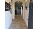 Inviting foyer with tile floors, modern decor and a view into the living area at 16124 Azure Key St, Winter Garden, FL 34787