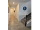 Bright foyer with stairs and an arched entry way to the open floorplan at 16124 Azure Key St, Winter Garden, FL 34787