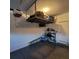 A well-kept garage featuring overhead storage, ensuring an organized space at 16124 Azure Key St, Winter Garden, FL 34787