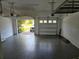 Spacious garage with epoxy floors, overhead storage racks, and an automatic door opener at 16124 Azure Key St, Winter Garden, FL 34787