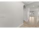 Bright hallway features tile flooring, arched doorway, and neutral paint at 16124 Azure Key St, Winter Garden, FL 34787