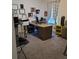 Functional home office space with a large desk and natural light at 16124 Azure Key St, Winter Garden, FL 34787