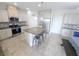 Bright kitchen features granite countertops, stainless steel appliances, and a kitchen island at 16124 Azure Key St, Winter Garden, FL 34787