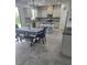 Bright, open kitchen with an island, stainless steel appliances, and dining area with bench seating at 16124 Azure Key St, Winter Garden, FL 34787