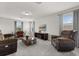 Spacious living room featuring neutral walls, plenty of seating, and lots of space at 16124 Azure Key St, Winter Garden, FL 34787