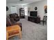 Spacious living room with comfortable seating, a large TV, and ample entertainment options at 16124 Azure Key St, Winter Garden, FL 34787