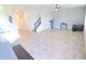 Spacious living room with tile floors and staircase leading to the upper level at 16124 Azure Key St, Winter Garden, FL 34787