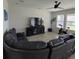 Comfortable living room featuring a large sectional sofa and a ceiling fan at 16124 Azure Key St, Winter Garden, FL 34787