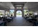 An outdoor lounge with tables overlooking a pool, ideal for relaxing at 16124 Azure Key St, Winter Garden, FL 34787