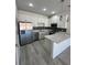 Beautiful kitchen with stainless steel appliances, quartz countertops and hardwood floors at 1840 Coriander Dr, Kissimmee, FL 34759