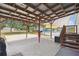 Backyard patio with pergola, adjacent to the above-ground pool for easy access at 18906 Merrich Rd, Orlando, FL 32820
